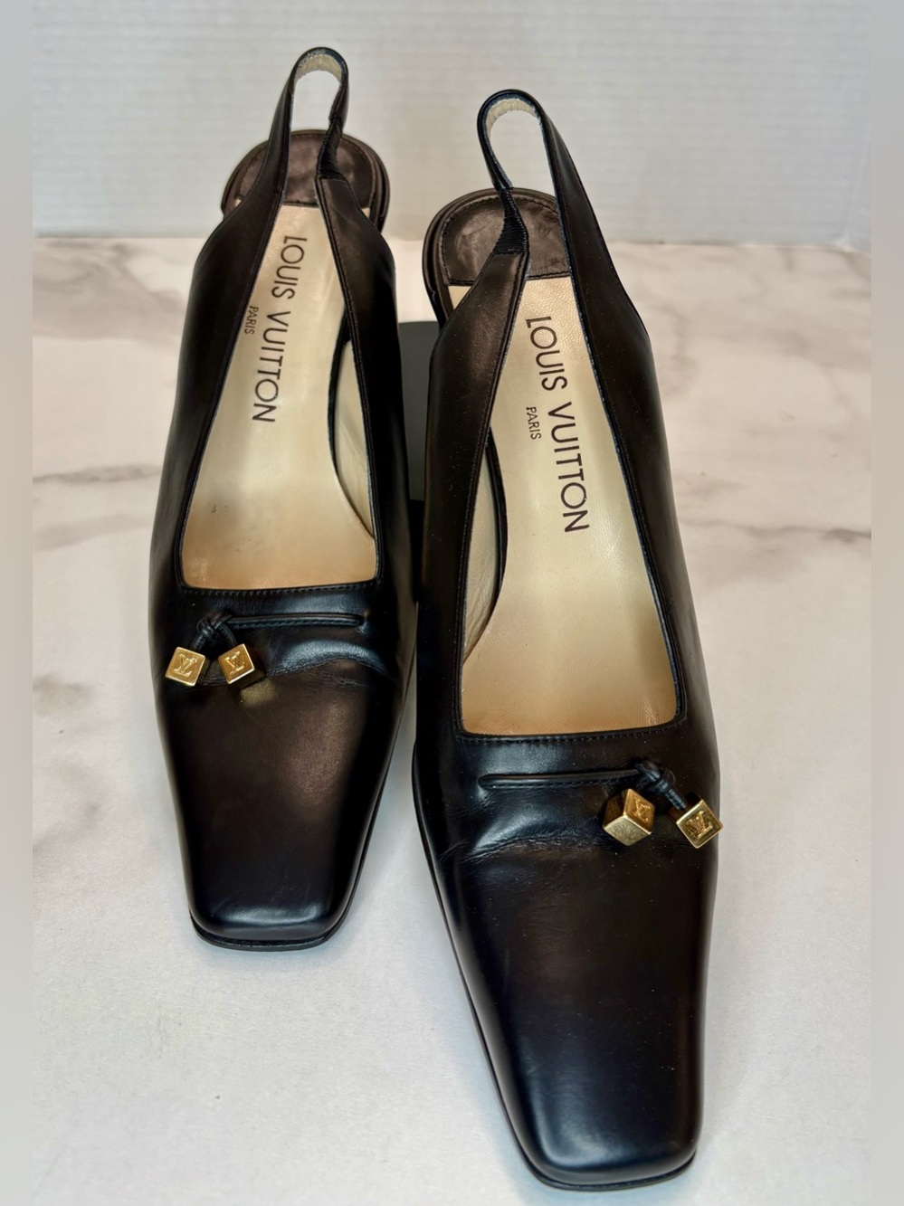 Louis Vuitton slingback 2 inch pumps,W/ gold-tone cube charms. Sz 37.5
